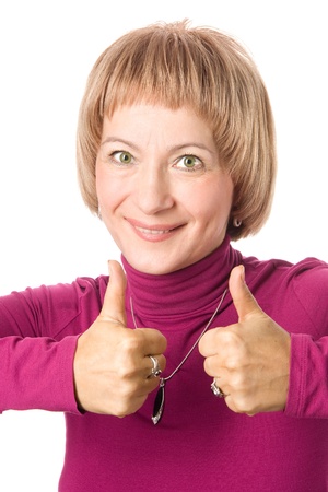 Middle-aged woman showing thumbs upの写真素材