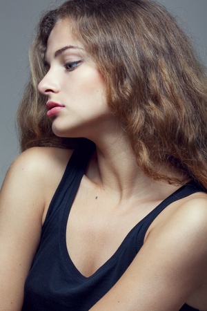 Beautiful sexy young woman with curly hairの写真素材