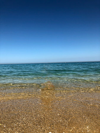 The calming and reflective sea of serenityの写真素材