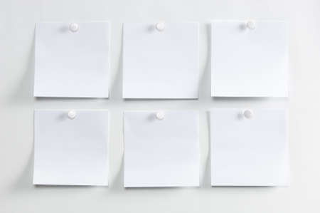 Blank paper, hanging on the wall with a pushpinの写真素材