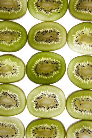 Kiwi cut into slices placed on a transparent planeの写真素材