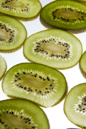 Kiwi cut into slices placed on a transparent planeの写真素材