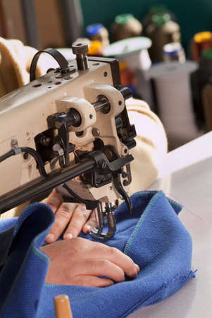 Industrial sewing machine that sews a blue cloth