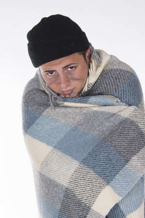 Shooting in a studio Homeless wrapped in a blanketの写真素材