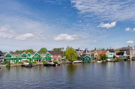 Typical buildings on the water cannel, at Zaanse Schans, Amsterdam, Hollandの写真素材