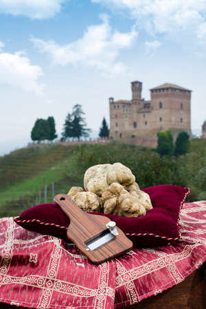 Grinzane Cavour, Italy - October 25, 2014: Still Life the White Truffles from Piedmont and size truffles, with views over the vineyards and the castle of Grinzane Cavourのeditorial素材
