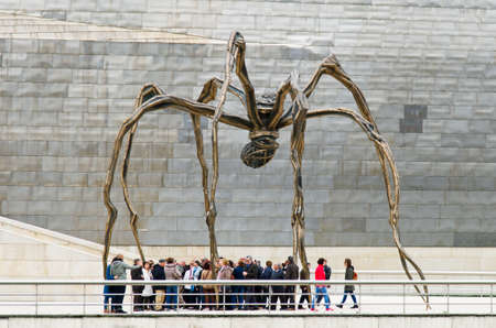 Bilbao, Spain - March 28, 2016: Maman sculpture, by Louise Bourgeois, Guggenheim Museum, Between the legs, numerous people seem trapped preyのeditorial素材