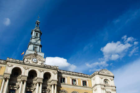 Detail of the City Hall Bilbao, Biscay, Spain, Europe, In front of a clear blue sky and white cloudsの写真素材