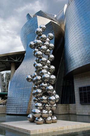 Bilbao, Spain - March 26, 2016: The great Tree and the Eye, sculpture by Anish Kapoor and Guggenheim Museumのeditorial素材