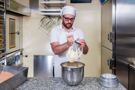 Pastry chef prepares typical hazelnut cake from Piedmont Langa Italyの写真素材