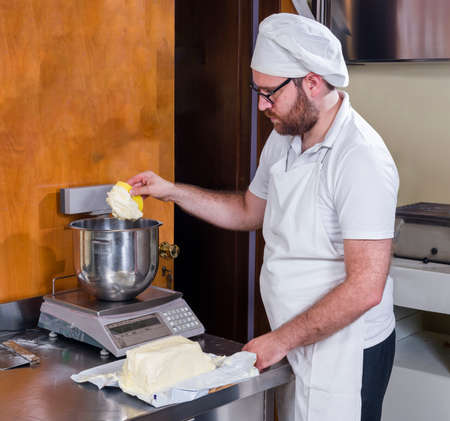 Pastry chef prepares typical hazelnut cake from Piedmont Langa Italyの写真素材