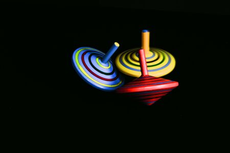 3 Toppling Spinning Tops Clustered