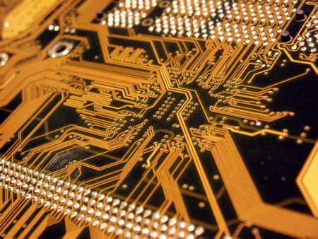 A shot of the back side of a new dual processor computer mother board.  This image is a nice background image for print material related to computer technology.の写真素材