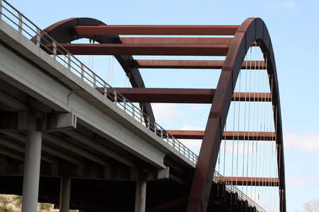 A shot of the Austin 360 Bridge on a clear calm day.  This is a very pretty picture of the bridge and a great symbol of Austin, Texas.の写真素材