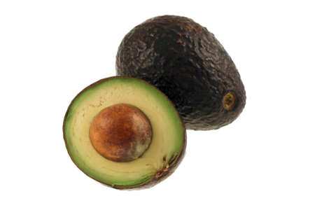 Avocados isolated on a white background and sliced with the seed.
