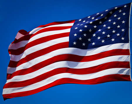 an american flag boldly flying in the wind
