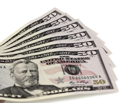A stack of fifty 50 dollar bills fanned out on a white background