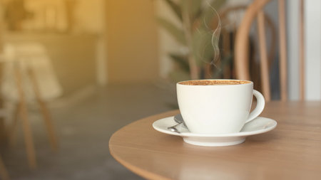 Coffee cup on wood table in cafe background, old wooden table. Simple workspace or morning coffee break.の写真素材