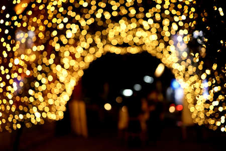 Curve golden light bokeh background at night.の写真素材