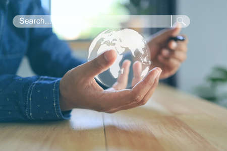 Data Search Technology Search Engine Optimization The whole world in the hands of business men means easy search and all information is in the palm of your hand.の写真素材