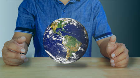 Humans are graphic the world in their arms under the  light signifies exploring the world. explore...
