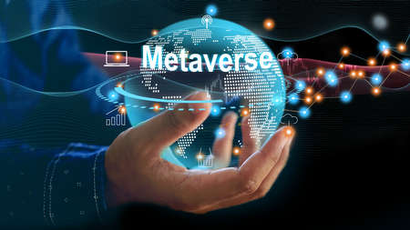 Man using virtual metaverse to manage data and analyze maketing online information to planing for future investment in a virtual and mataverse maket. Globe in business man hand.の写真素材