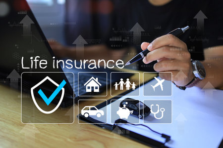 man is clicking life insurance program choose life insurance plans such as travel, health, car and home insurance. Life planing concept.の写真素材