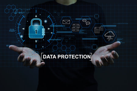Data protection concept man holding a padlock as protection against hacker and online theft or...