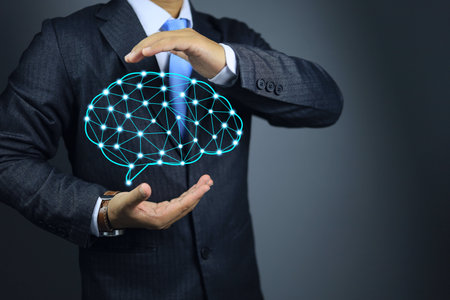 Developer holding a brain in hand communicating development and neuro transmitter abstract digital human. Neural network. IQ testing, artificial intelligence virtual emulation science technologyの写真素材