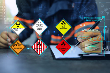 Security officers writing on clipboards and inspect the storage of dangerous goods in the warehouse for operator safety such as explosions, radioactive, toxic gases, etc.の写真素材