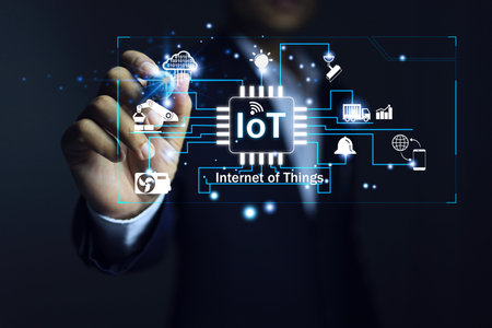 Businessman using iot or internet of things to enable connected electronic devices and can be controlled remotely and connection.の写真素材