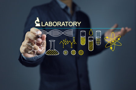 Healthcare businessman writing dna or laboratory technology knowledge of chemistry, test tubes, chemical bonds and genetics for medical research and development.の写真素材