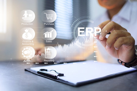 Enterprise resource planning concept or ERP with businessman working on desktop to manage factory inventory and production schedule to keep revenue increase trend.の写真素材