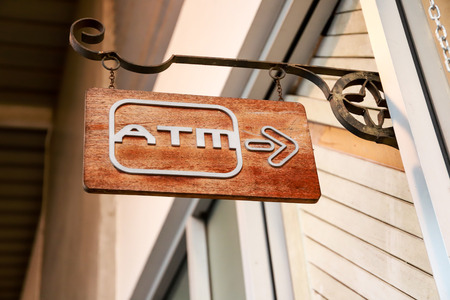 Signpost to go to the ATMの写真素材