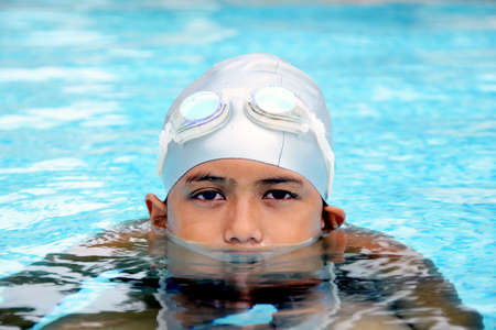 Asian Boy in the swimming pool の写真素材