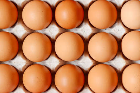 Chicken eggs on tray in supermarket.