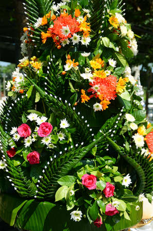Thai craft made from banana leaves decorated with flowers の写真素材