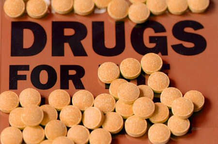 Pills on text book の写真素材
