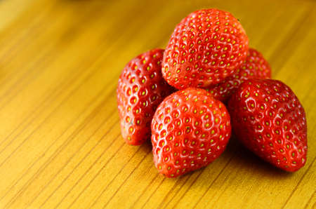 Fresh strawberry on wooden table の写真素材