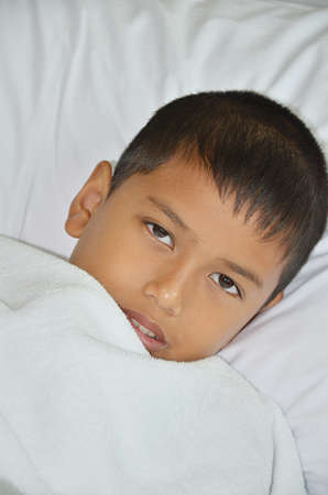 Sick boy just wake up の写真素材