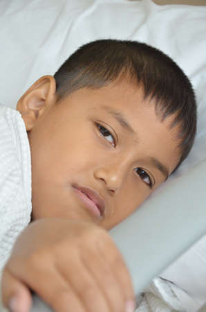 Sick boy just wake up の写真素材