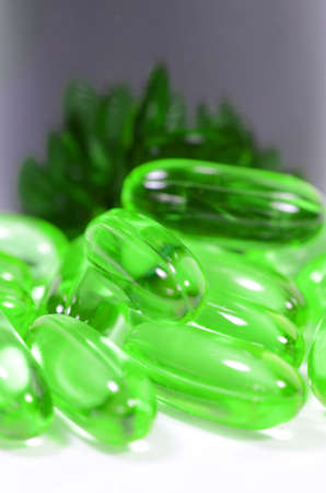 Medicine bottle and vitamin capsules の写真素材