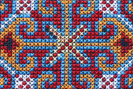 Cross stitch embroidery on canvas の写真素材