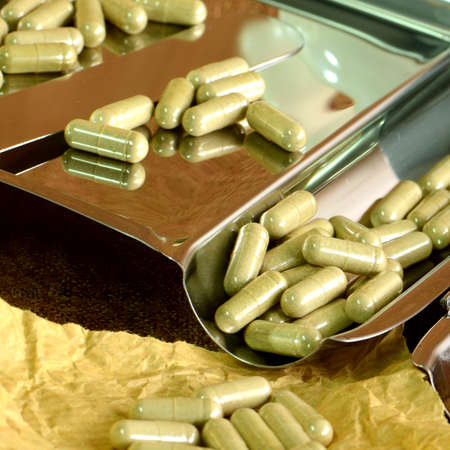 Medicine counting tray and herbal medicine capsules の写真素材
