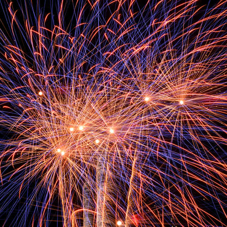 abstract background of explosion line of firework in closed-up on dark sky の写真素材