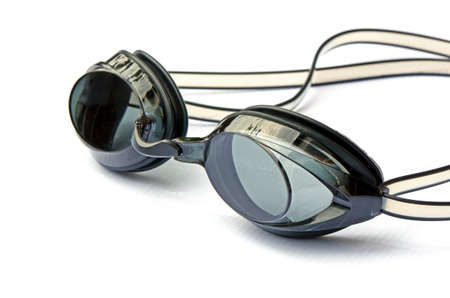 Sport swimming goggles on white canvas の写真素材