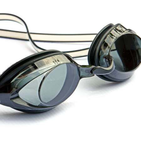 Sport swimming goggles on white canvas の写真素材