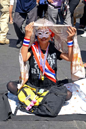 Unidentified protesters protest against Thai government corruption in the second day of joining  Shut down Bangkok  campaign  on January 14,2014 in Bangkok,Thailand のeditorial素材