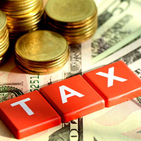 Money and time for any kind of taxes payment concept with dollars bank note background の写真素材