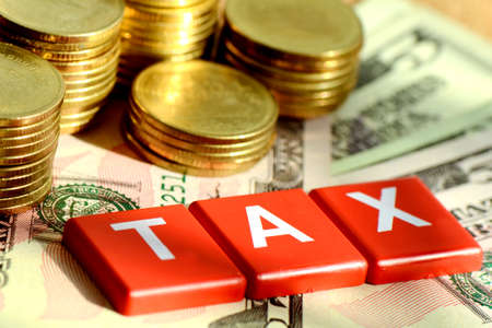 Money and time for any kind of taxes payment concept with dollars bank note background の写真素材